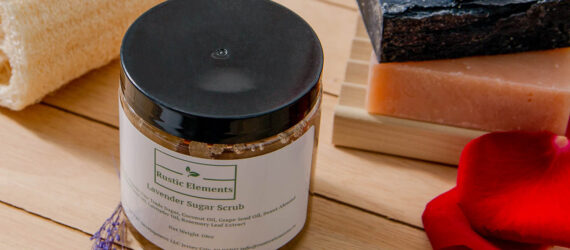 A jar in front of a stack of soap bars