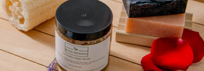 A jar in front of a stack of soap bars
