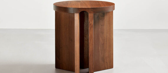 Walnut Umo accent table with a simple background
