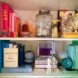 A bookshelf organized according to color