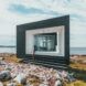A tiny house set near a lake or ocean