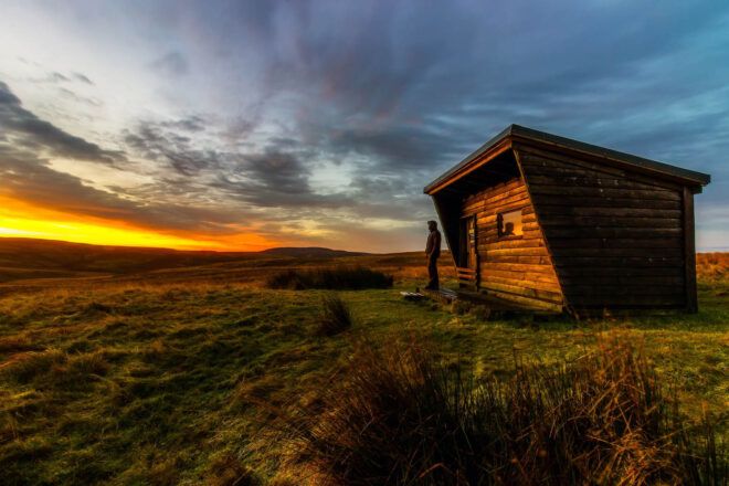 A tiny house set on a large plain