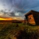 A tiny house set on a large plain