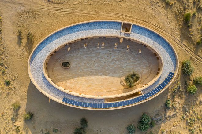 A shot from above down below on the oval shaped school