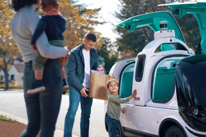 A family getting their groceries from Nuro