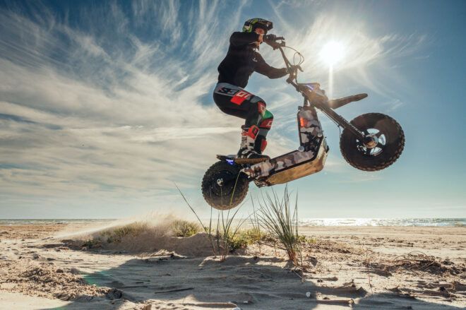 A rider doing a jump with the scooter