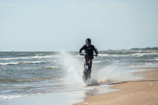 The Mosphera driving on the beach against small ocean waves