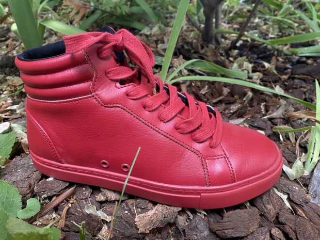A red sneaker faced to the right