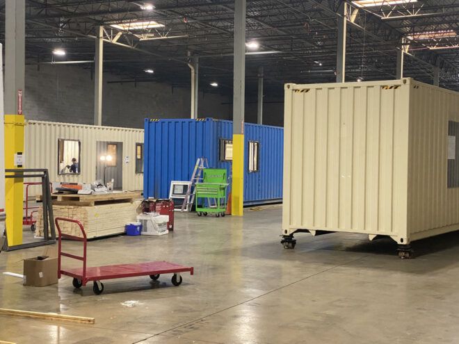Inside the warehouse with containers being revamped