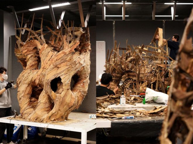 Students working on the structures made from paperbark