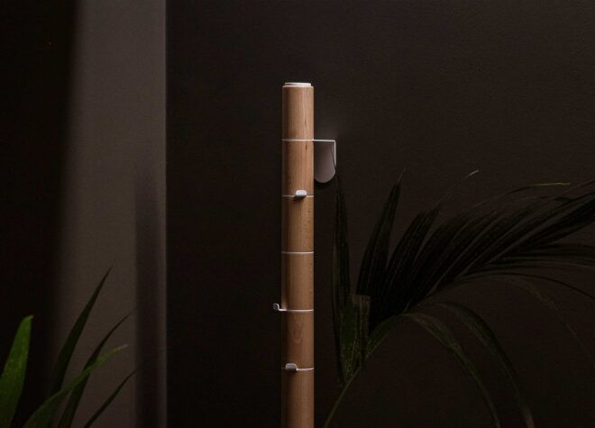 The top of a wooden coat rack
