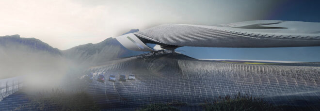 A long structure set in a sandy landscape