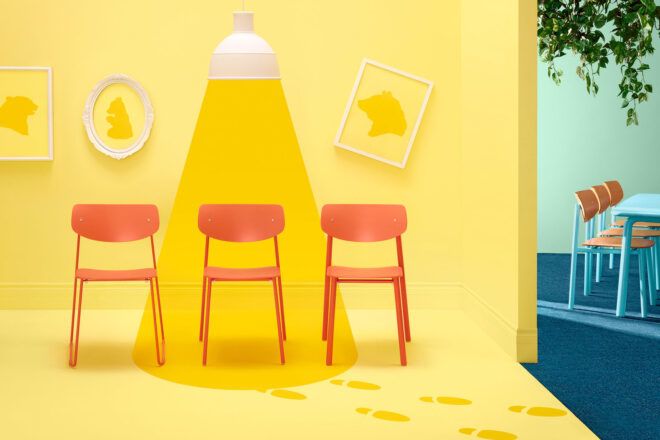 Red chairs in a yellow backdrop
