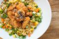 Orange cauliflower meal on a white plate