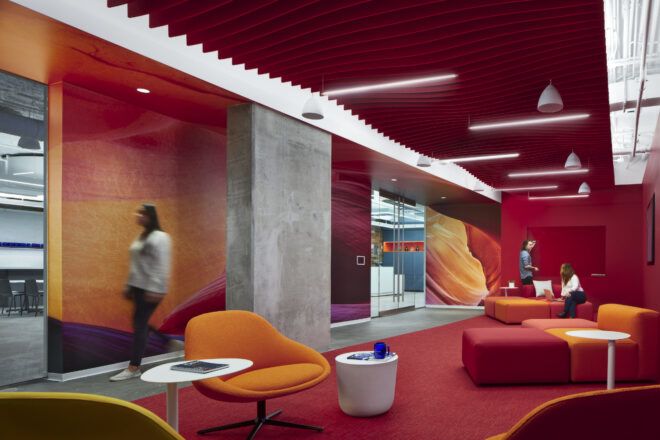 Red and orange themed lounge space with Hues Red ceiling baffles