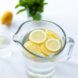 A water pitcher with lemons