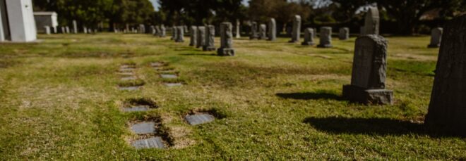 A gravesite with tombstones