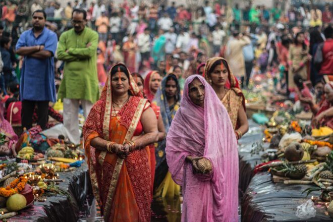 A group of Indian people in a busy bazaar