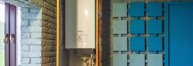 A heater system in a brick walled room