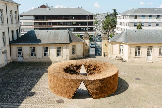 A circular wooden art installation