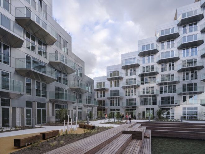 A ground level view of the building, showing some apartments and courtyard