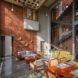 A living room space with brick walls