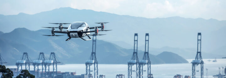 X2 flying over water with mountains in the background