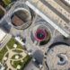 An aerial view of a pavilion area with three circular fenced zones