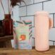 Pink silicone shampoo bottle with sachets