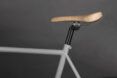 White bike with a cork saddle