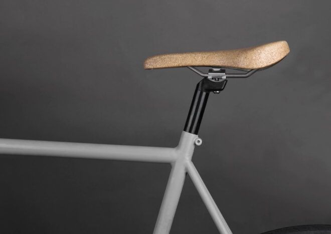 White bike with a cork saddle