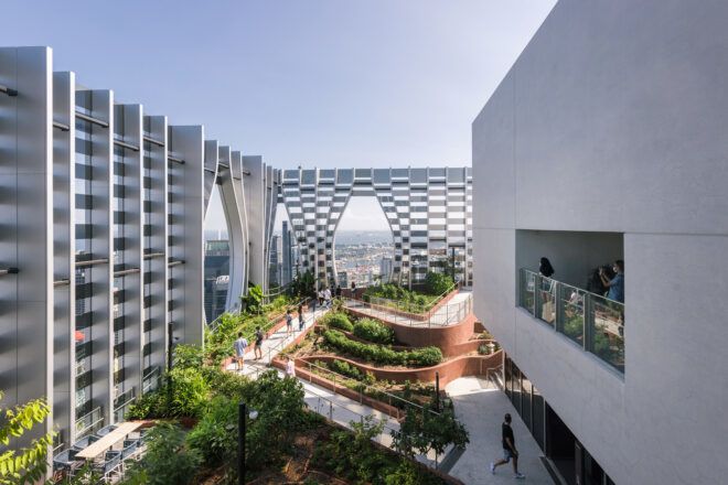 A outdoor level of the building features a pavilion and walkways