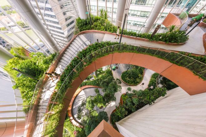 A photo taken from above below through the multiple walkways and levels all the way to the ground