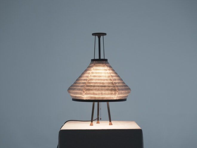 A triangular lamp on a platform