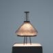 A triangular lamp on a platform