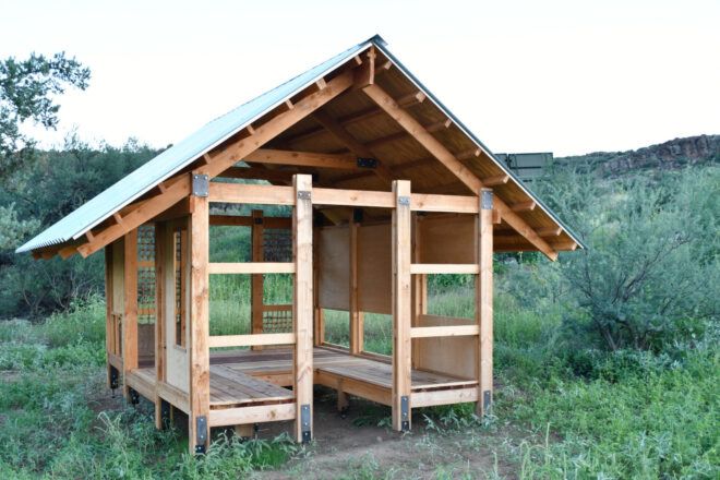 Small, pitched roof shelter in a field