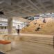 Wooden bleachers within the library for speakers or students to study