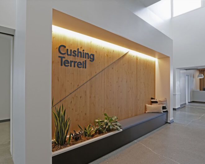 Wood wall with "Cushing Terrell" on it
