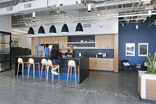 Industrial looking kitchen with bar stools