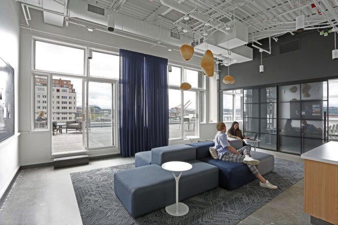 Floor to ceiling windows with navy curtains