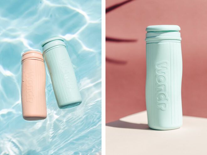 Silicone bottles in blue and pink in water