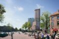 A tall tower in the midst of a street way with people biking