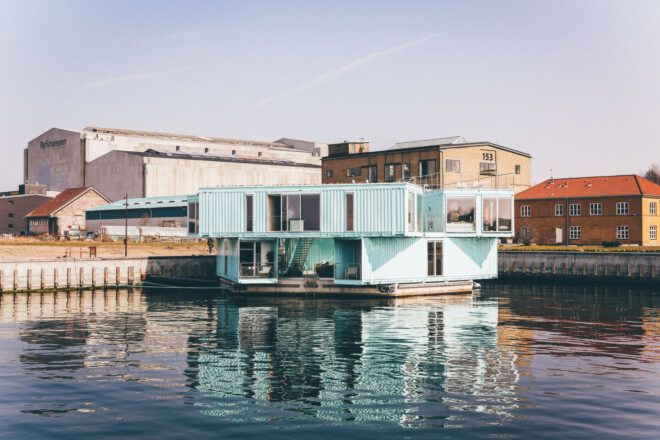 A houseboat painted a light blue