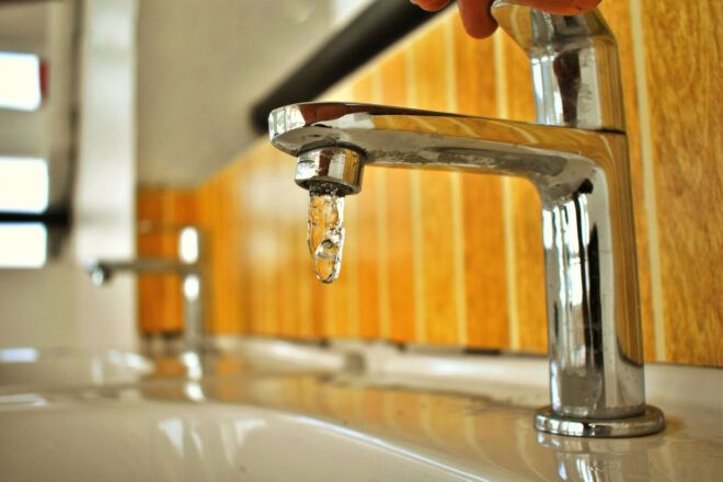 A sink with running water