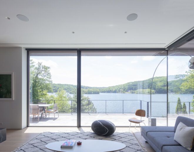 A living room with floor-to-ceiling windows