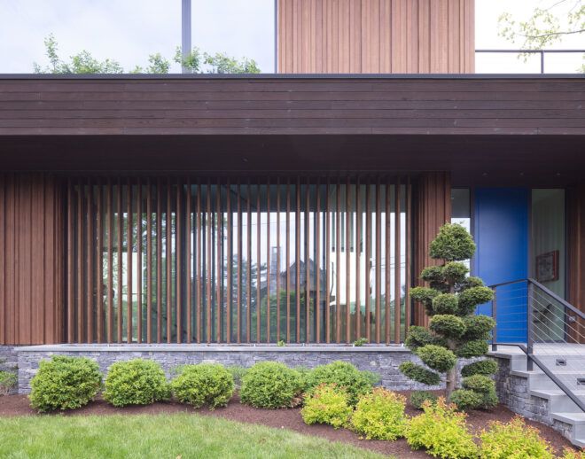 A barred window with wooden vertical lines