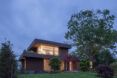 A two story home lit up at night