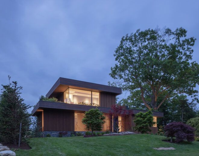 A two story home lit up at night