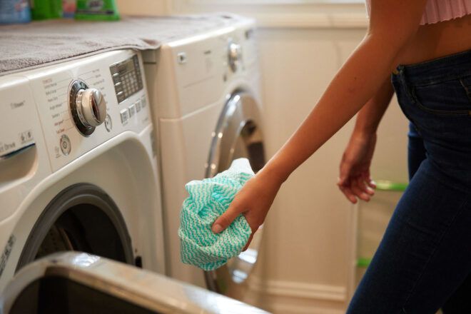 Reusable cloth being put into the washer