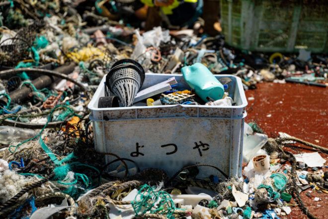 Crate with plastic waste amidst a heap of fishing waste extracted from the GPGP